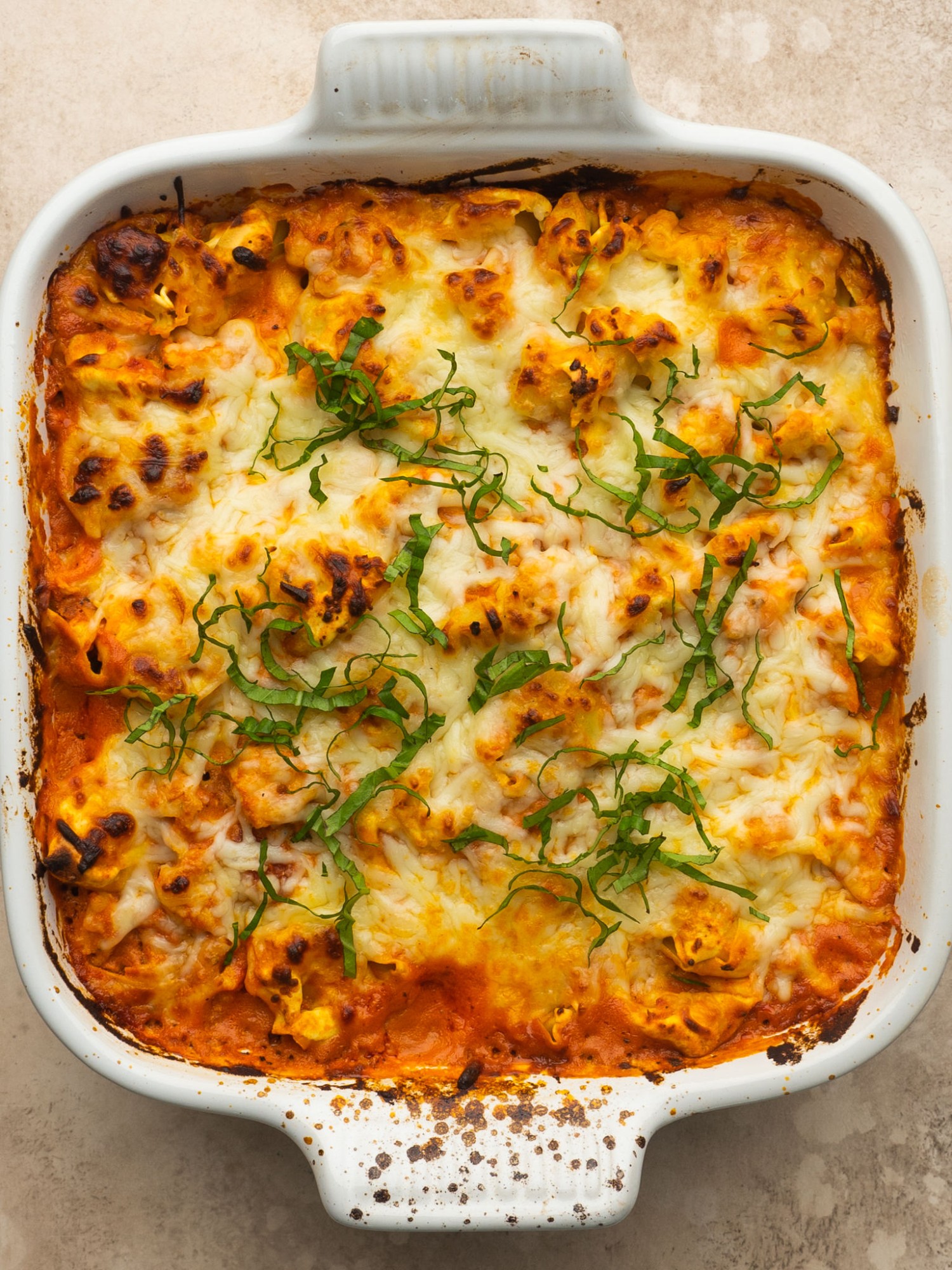 Above view of baked tortellini in a casserole dish