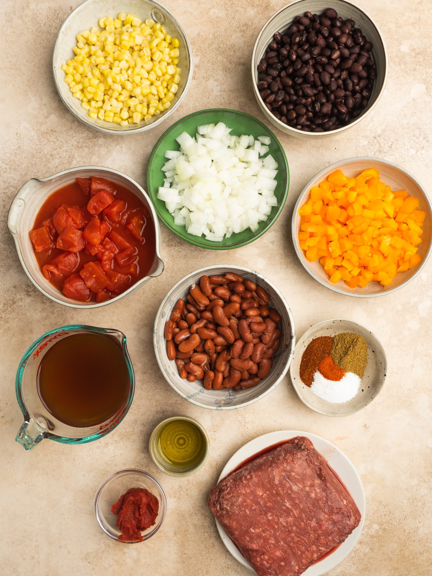 Above view of ingredients for a chili and cornbread pie