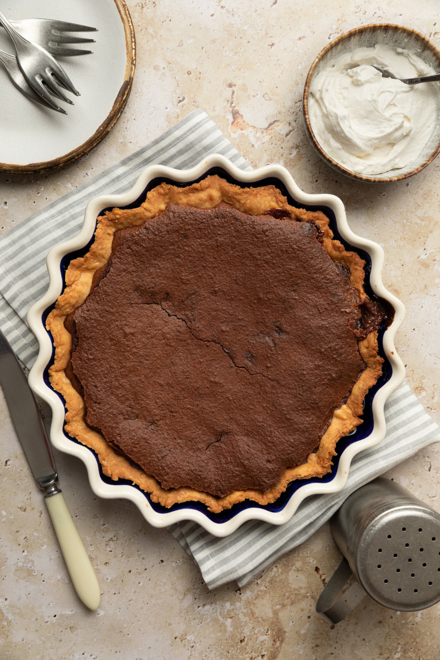 Baked chocolate chess pie in a pie plate