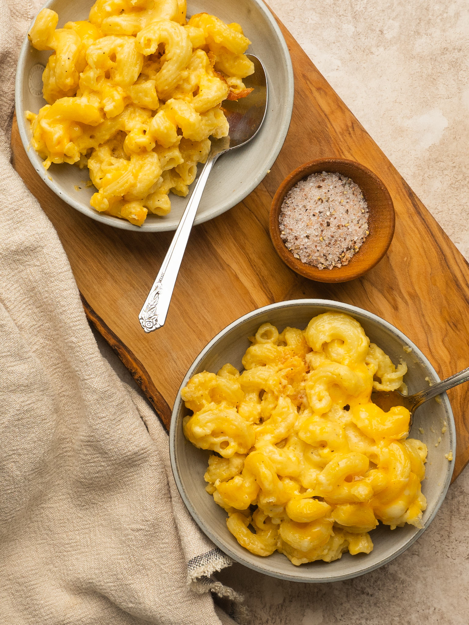 Above view of old fashioned baked macaroni and cheese served in two serving bowls