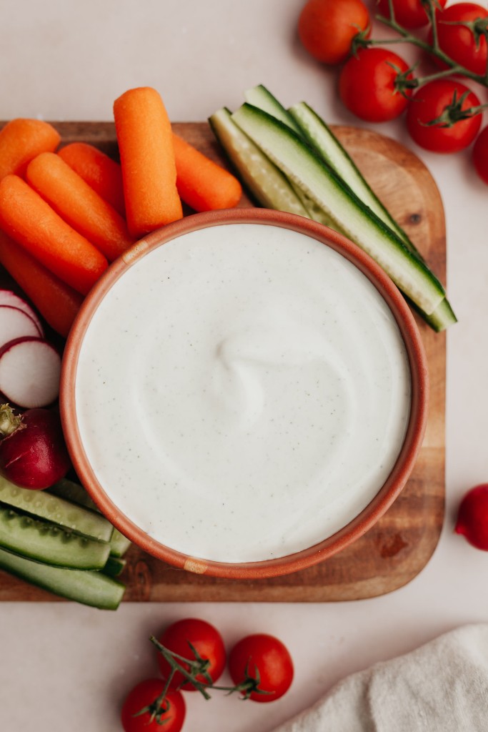 Above view of whipped cottage cheese dip served with chopped veggies