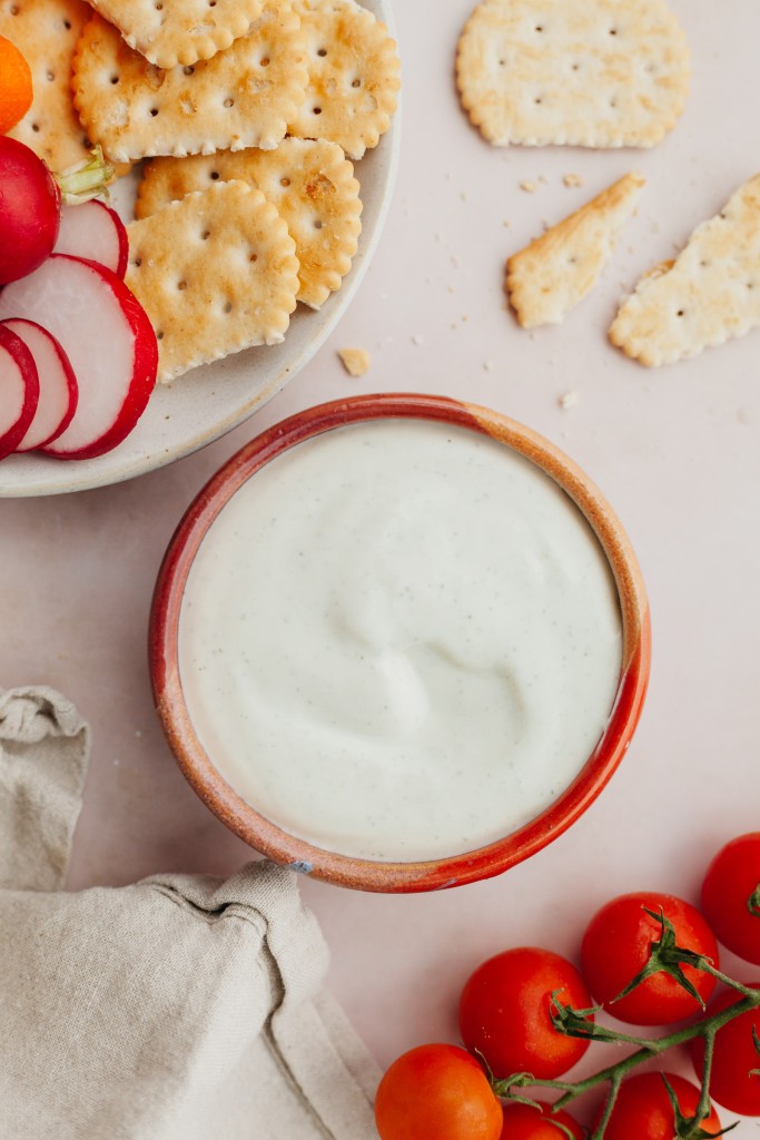 Whipped cottage cheese dip served with chopped veggies and crackers