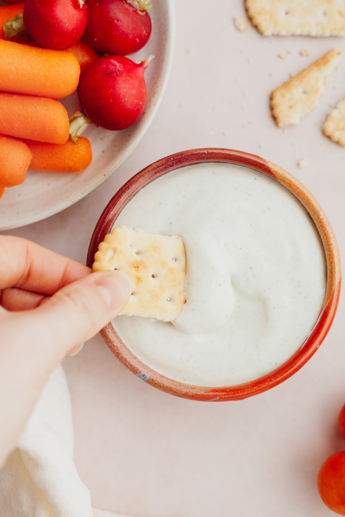 Whipped cottage cheese dip served with chopped veggies and crackers