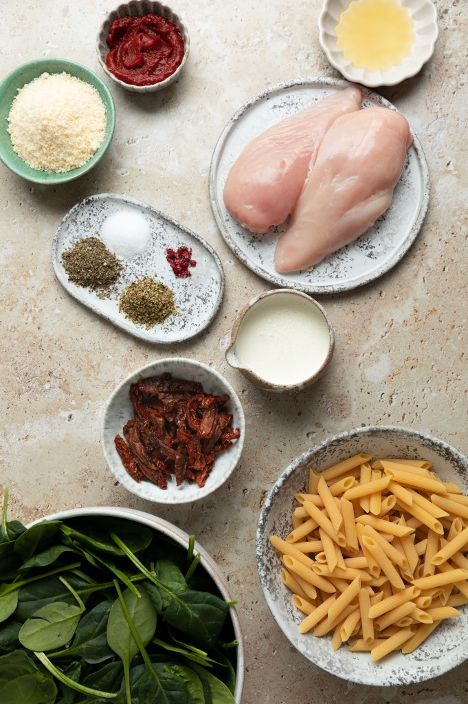 Above view of ingredients for a tuscan chicken recipe
