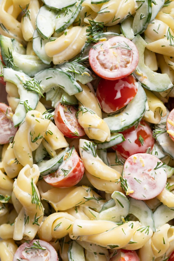 Close up above view of cucumber tomato salad with pasta