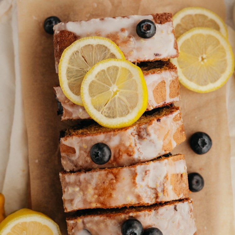 Above view of a loaf of blueberry lemon bread with slices cut through