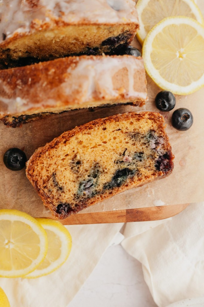 Above view of a slice of lemon blueberry bread cut off the loaf