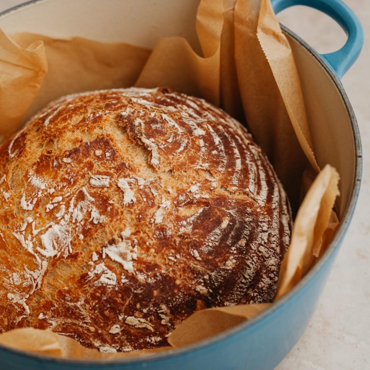 homemade loaf of bread in a dutch oven