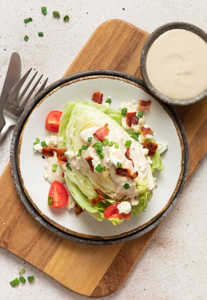 Above view of a wedge salad on a serving polate
