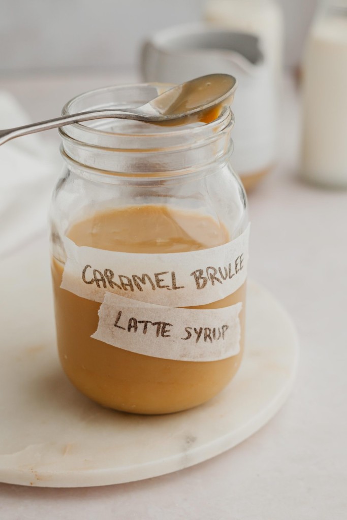 Side view of a jar of homemade caramel brulee latte strup