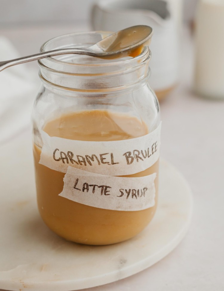 Side view of a jar of homemade caramel brulee latte strup
