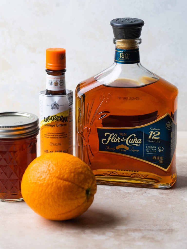 side view of ingredients for a rum old fashioned recipe