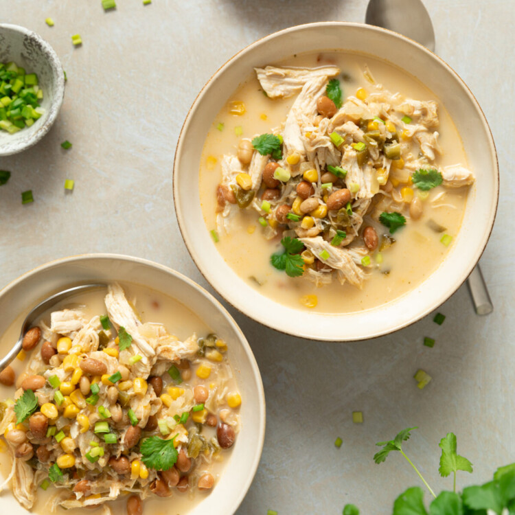 an above photo of two white bowls with servings of white chicken chili