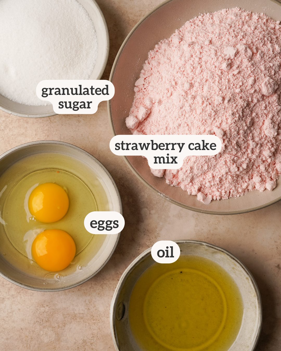 Above view of ingredients for strawberry cake mix cookies with labels on each ingredient