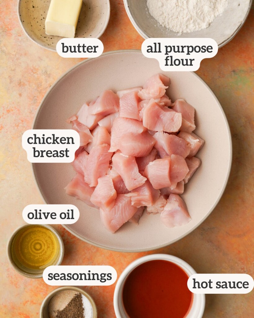 an above view photo of the ingredients for buffalo chicken bites with labels on them