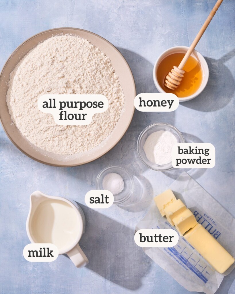 an above view photo of the ingredients for honey butter biscuits with labels on them