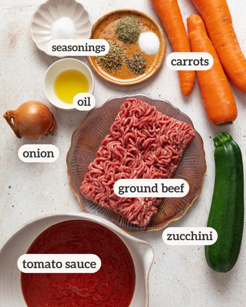 an above view image of the ingredients for hidden veggie pasta sauce with labels on it