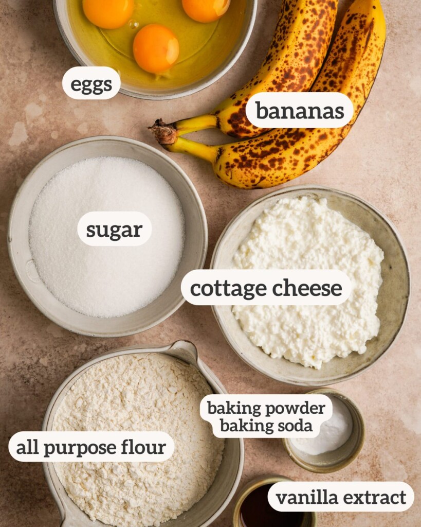 Overhead view of all of the ingredients for protein banana with la bels on each ingredient