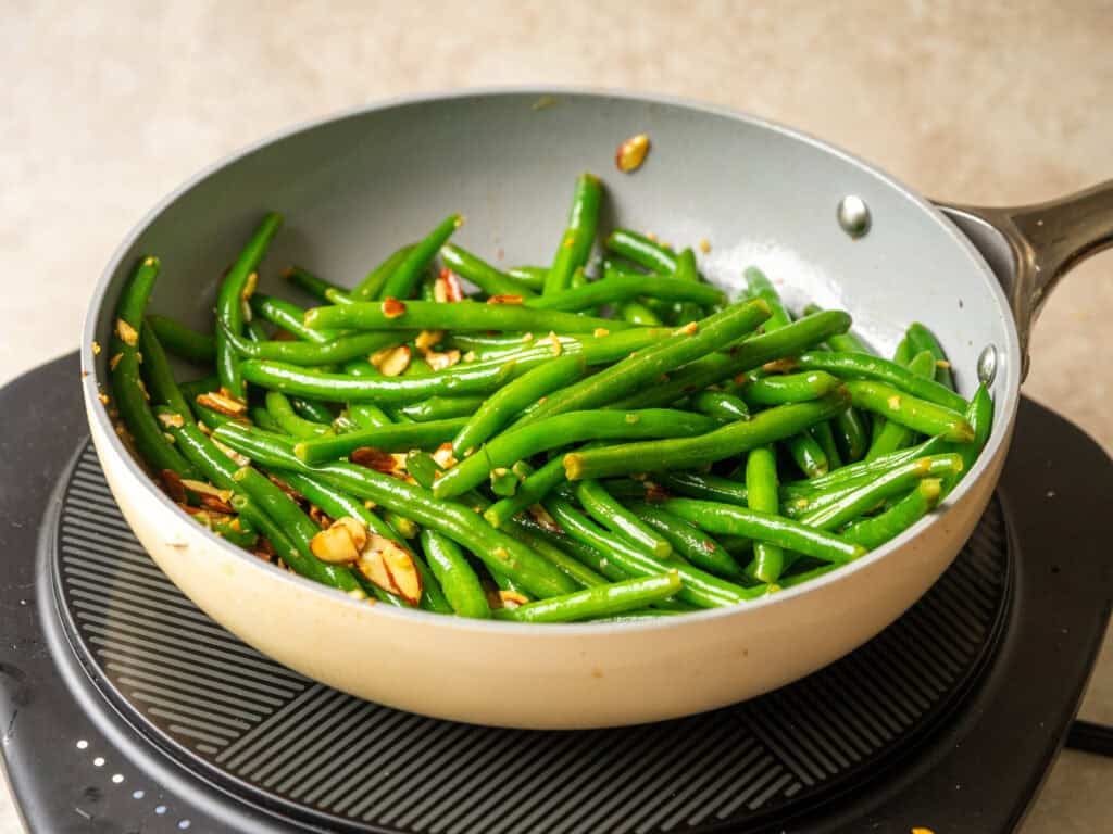 green beans and almonds in a nonstick pan