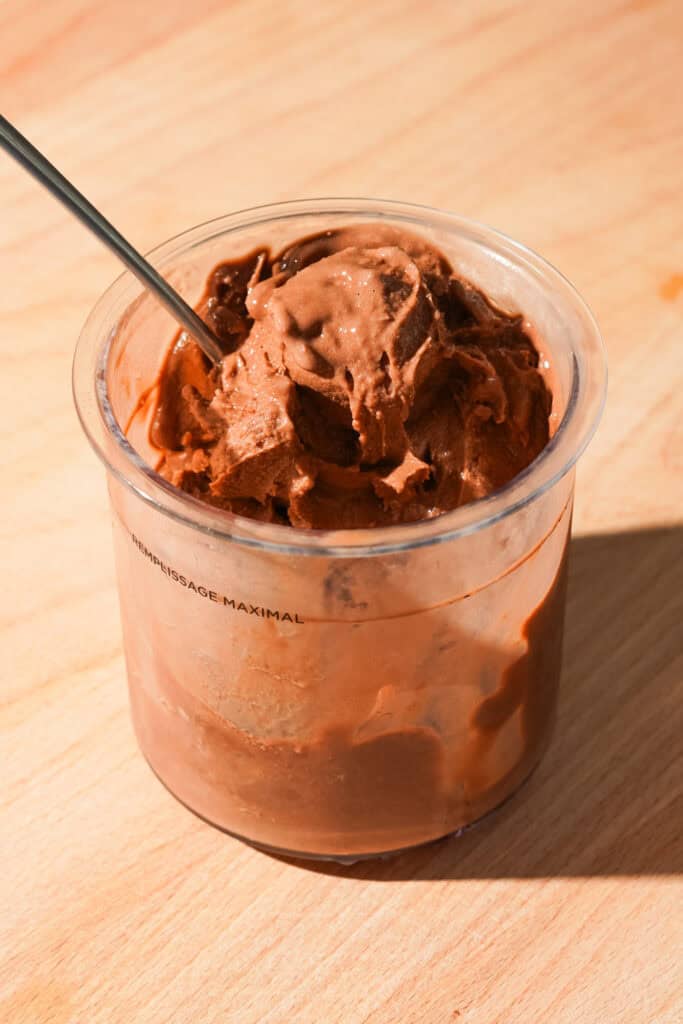 Three quarter view of a high protein chocolate creami recipe in a creami pint