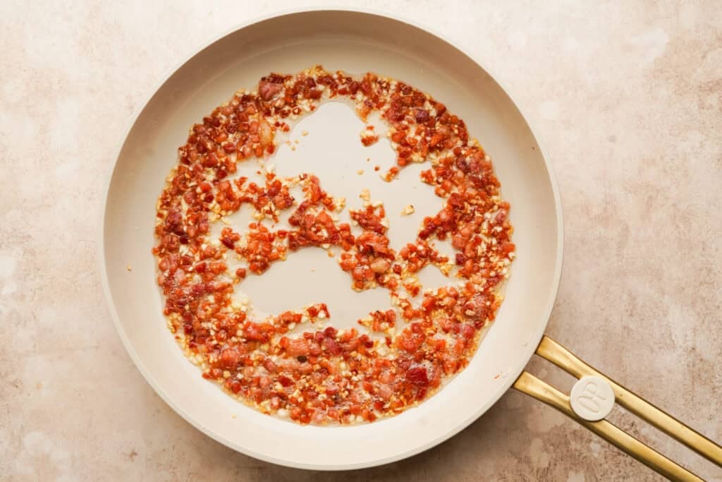 cubed pancetta cooking in a pan