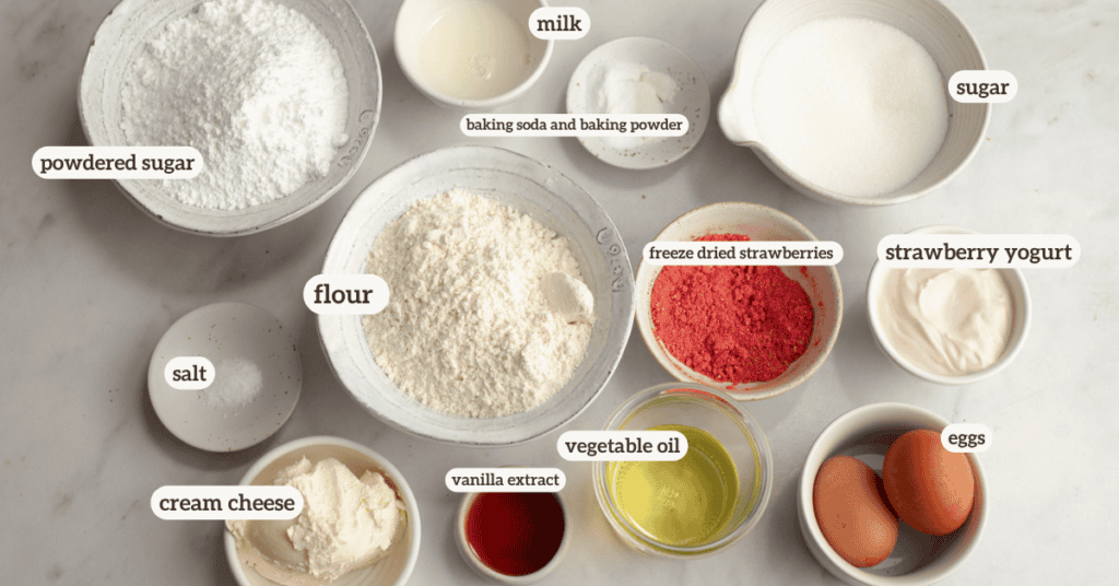 full ingredients for strawberry snack cake with strawberry cream cheese frosting