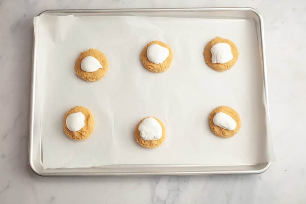cookie dough scoops with marshmallow dollops on them 