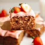 a piece of strawberry snack cake held up on a serving knife