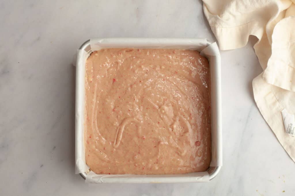 strawberry snack cake batter in baking pan