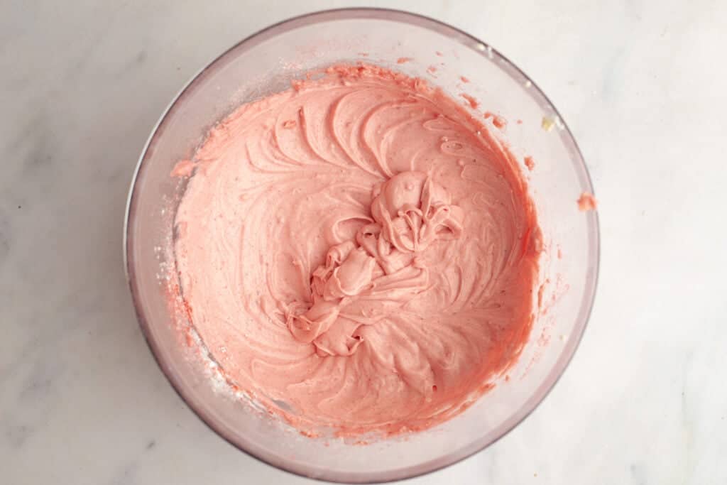 strawberry cream cheese icing mixture in bowl
