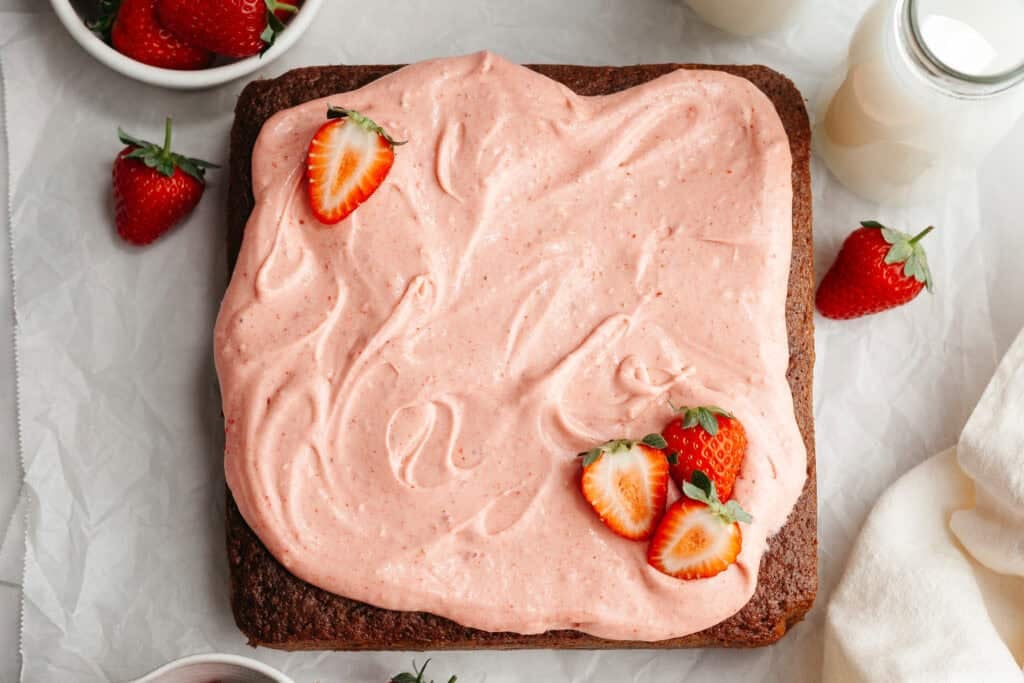 final dish of strawberry snack cake with strawberry cream cheese icing