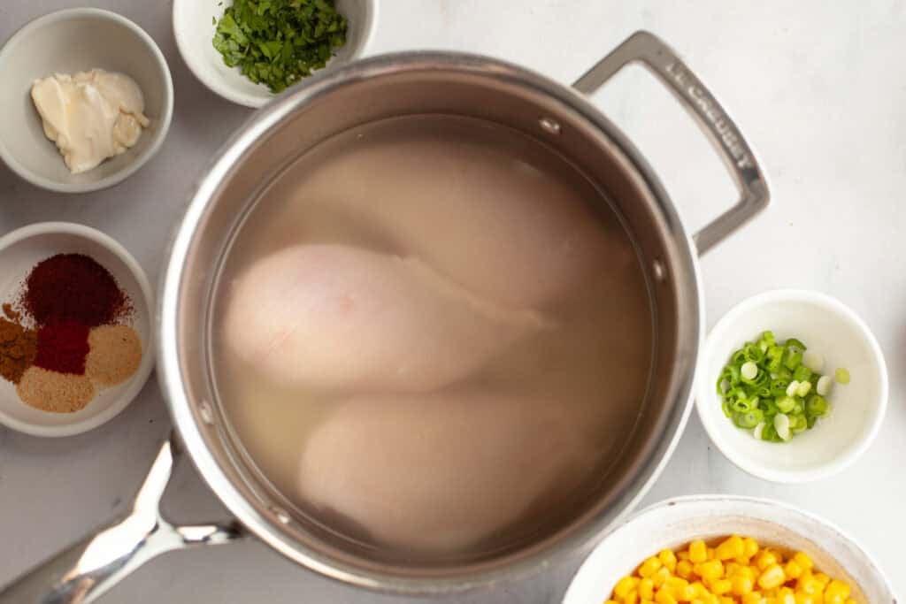 chicken in pot about to be poached