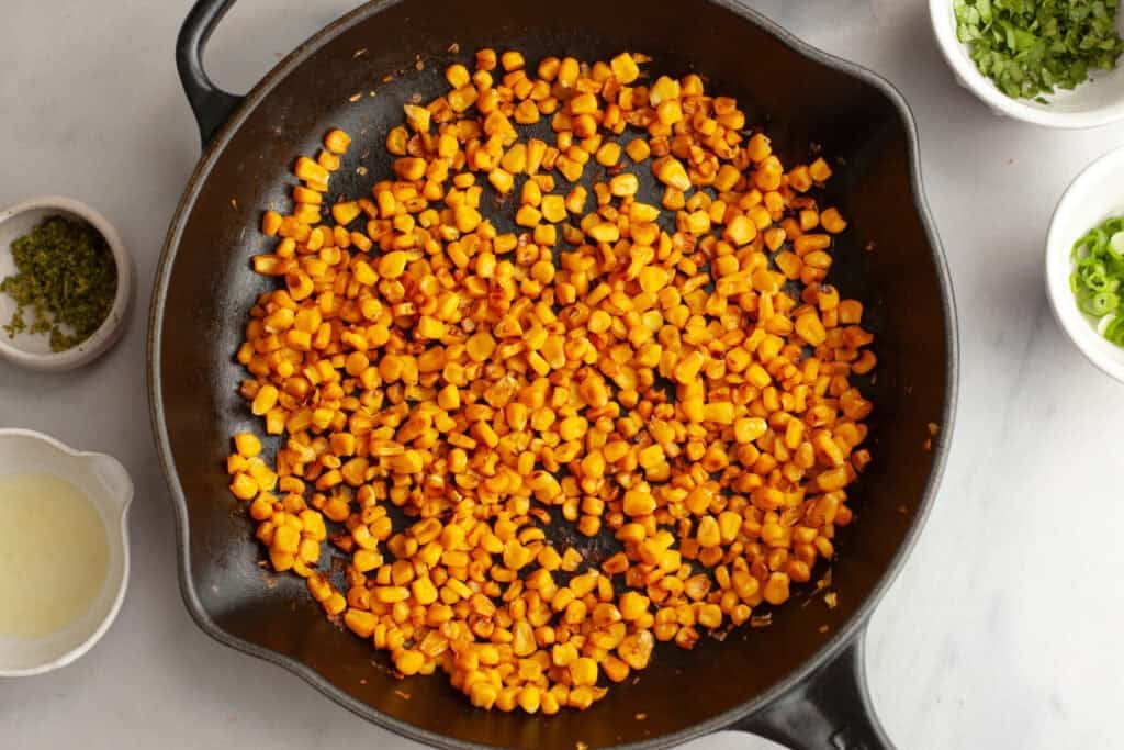 charred corn in a skillet