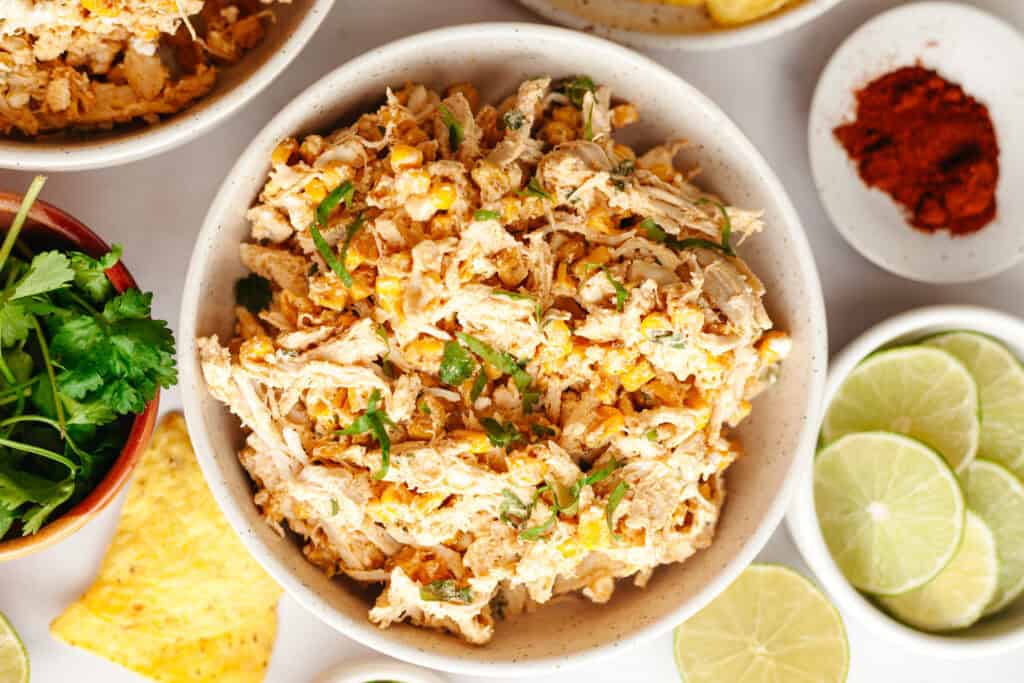 a bowl of mexican street corn chicken salad