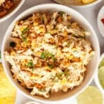 a bowl of mexican street corn chicken salad