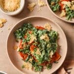 buffalo chicken cutlet on a plate with kale slaw