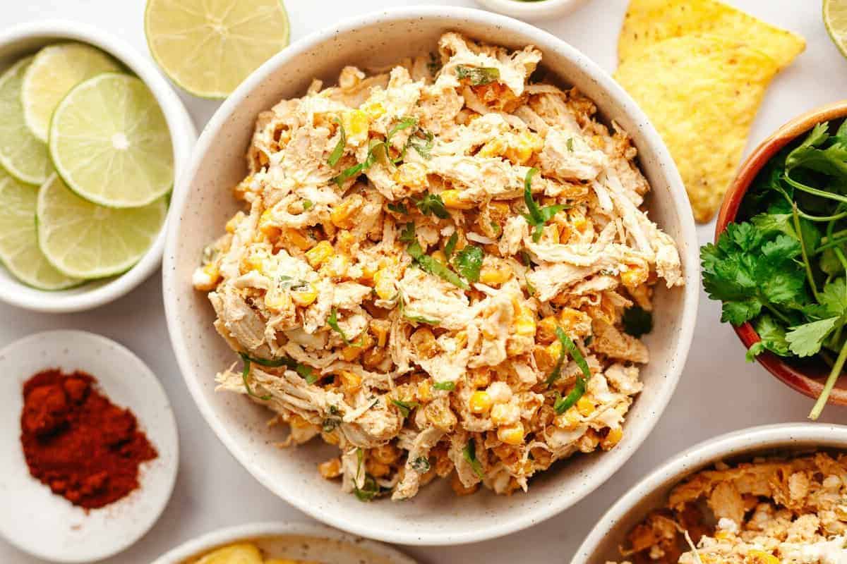 a bowl of mexican street corn chicken salad