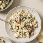 3 bean cobb salad on a plate with a spoon in it
