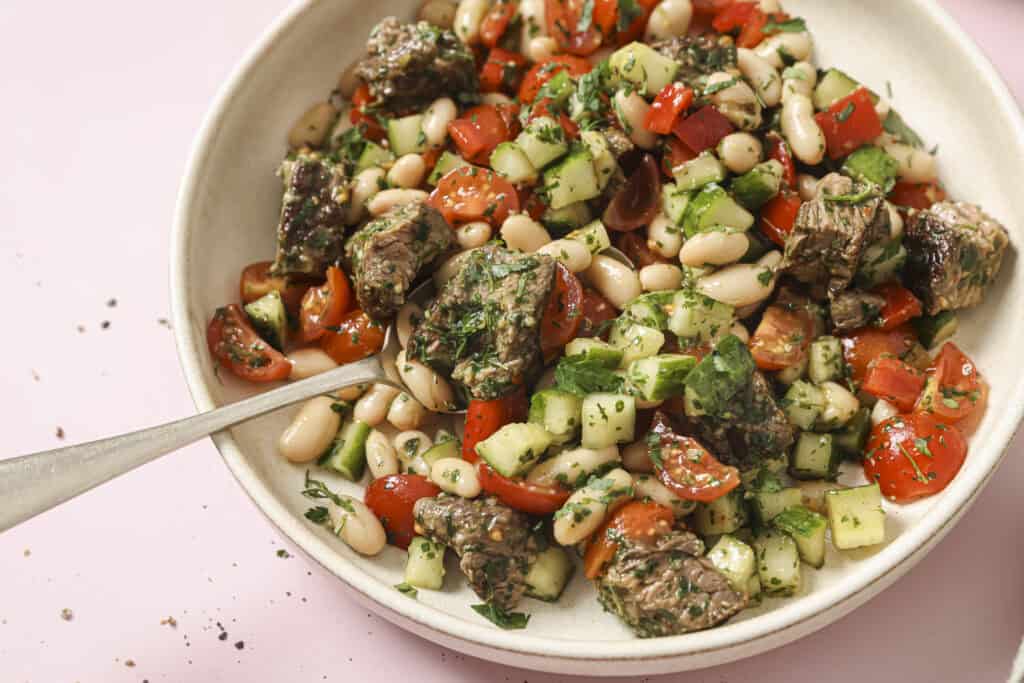 close up of chimichurri steak salad