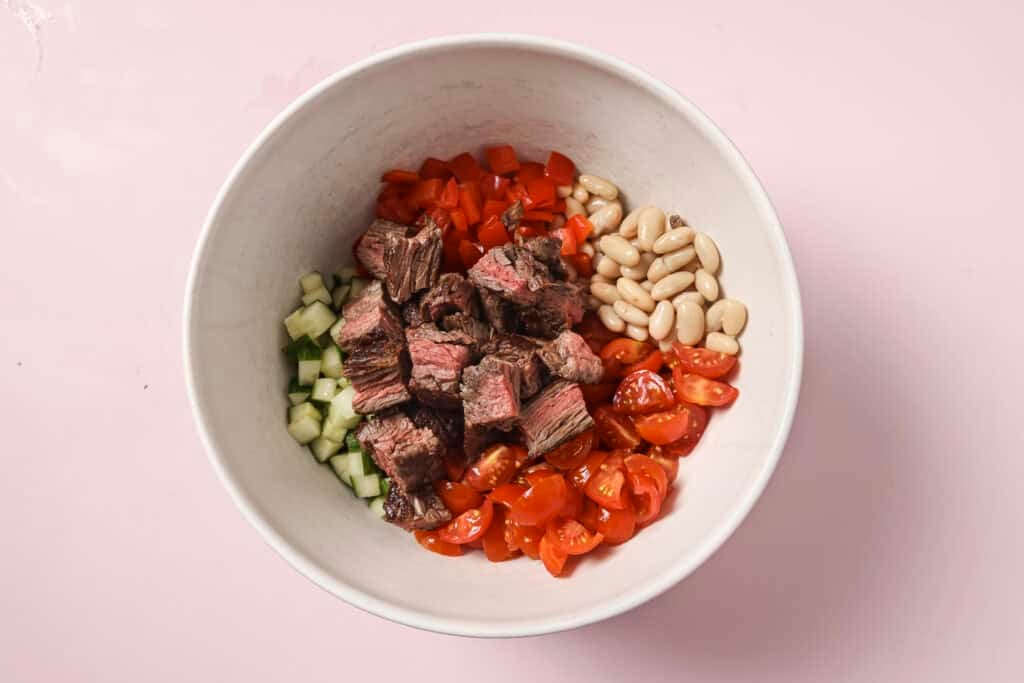 steak salad ingredients in a bowl