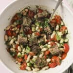 final dish of chimichurri steak salad in a bowl with a spoon
