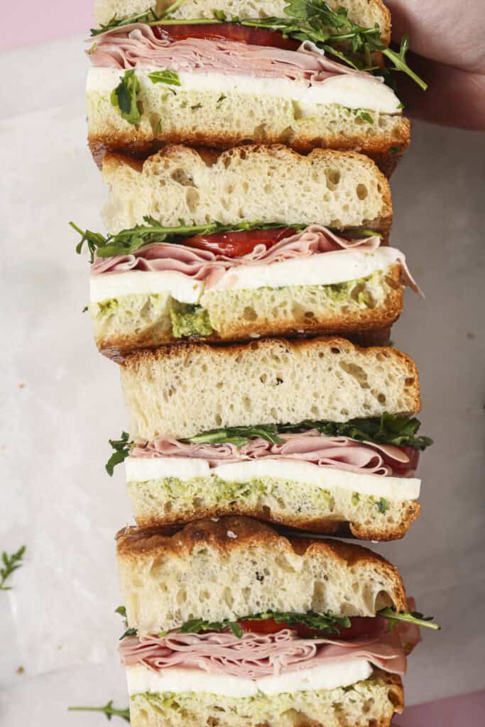 A summer focaccia sandwich cut into slices lined up next to each other