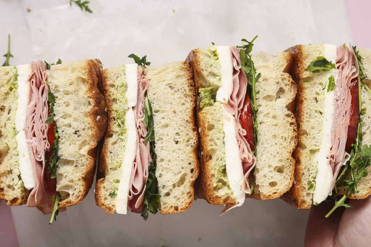 A summer focaccia sandwich cut into slices lined up next to each other