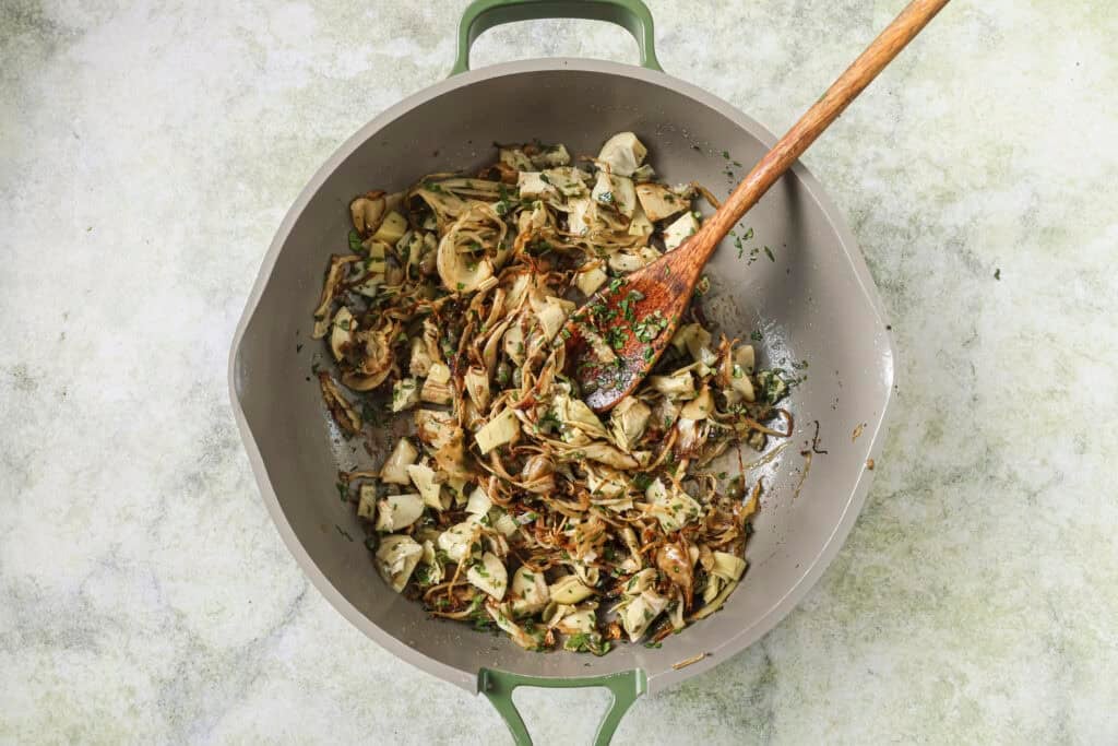 artichoke hearts, capers, parsley, and balsamic vinegar in the skillet with sausage and fennel