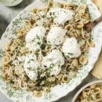 a final dish of sausage fennel pasta with burrata on top