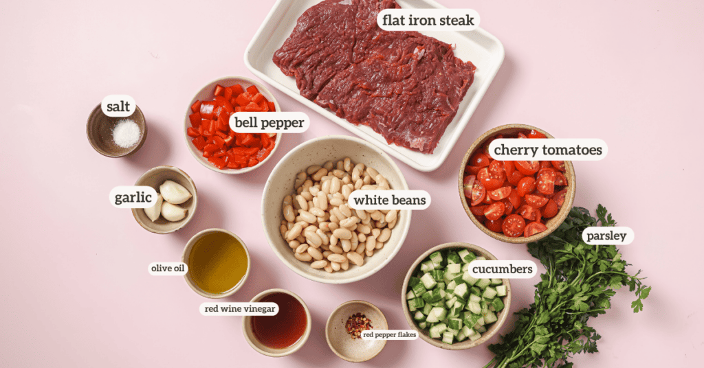 chimichurri steak salad ingredients in small bowls with a label on each ingredient