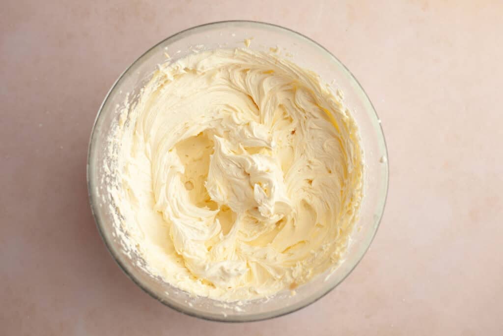 a bowl of layered cookie cake frosting