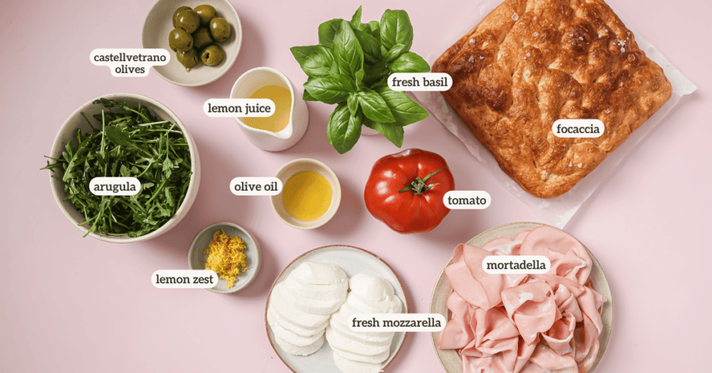 ingredients for a summer focaccia sandwich with labels on each ingredient