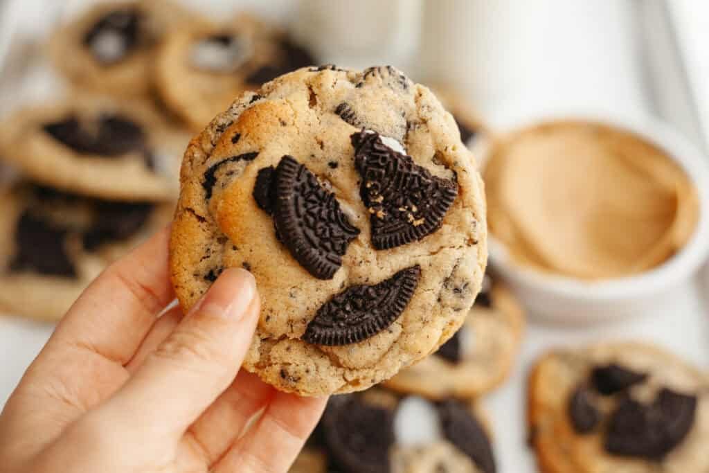 hand holding an oreo peanut butter cookie