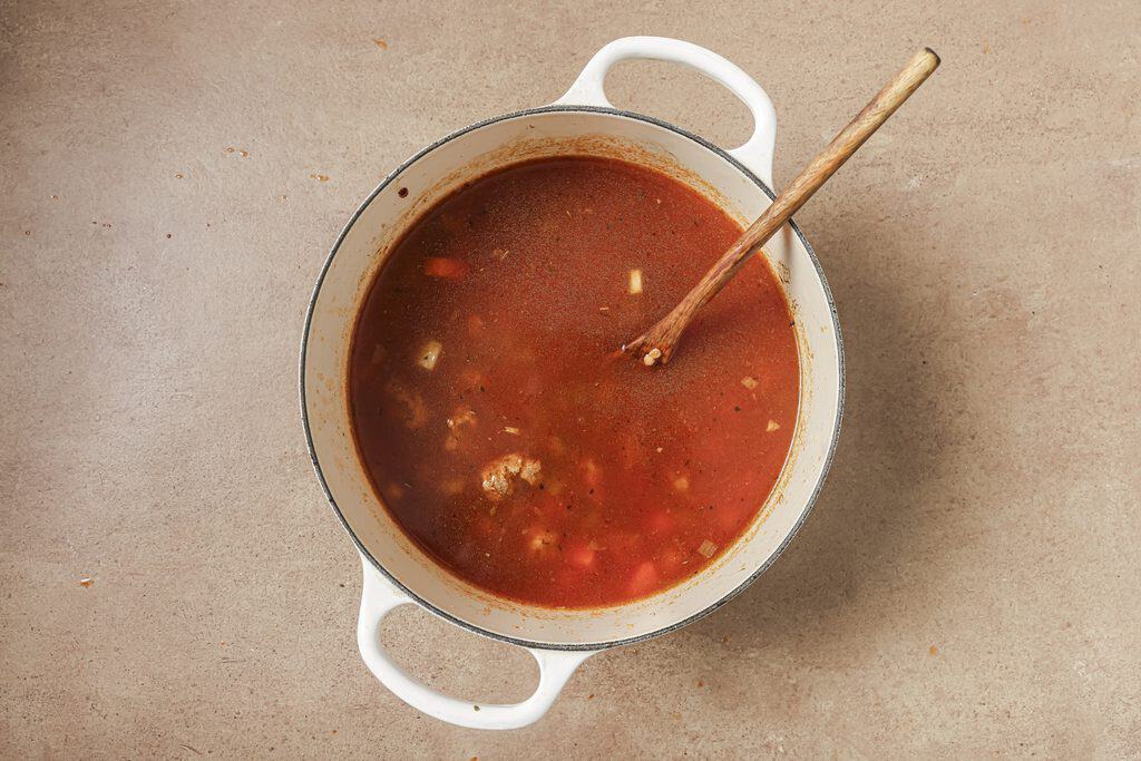lentil sausage soup ingredients in a pot before being boiled 